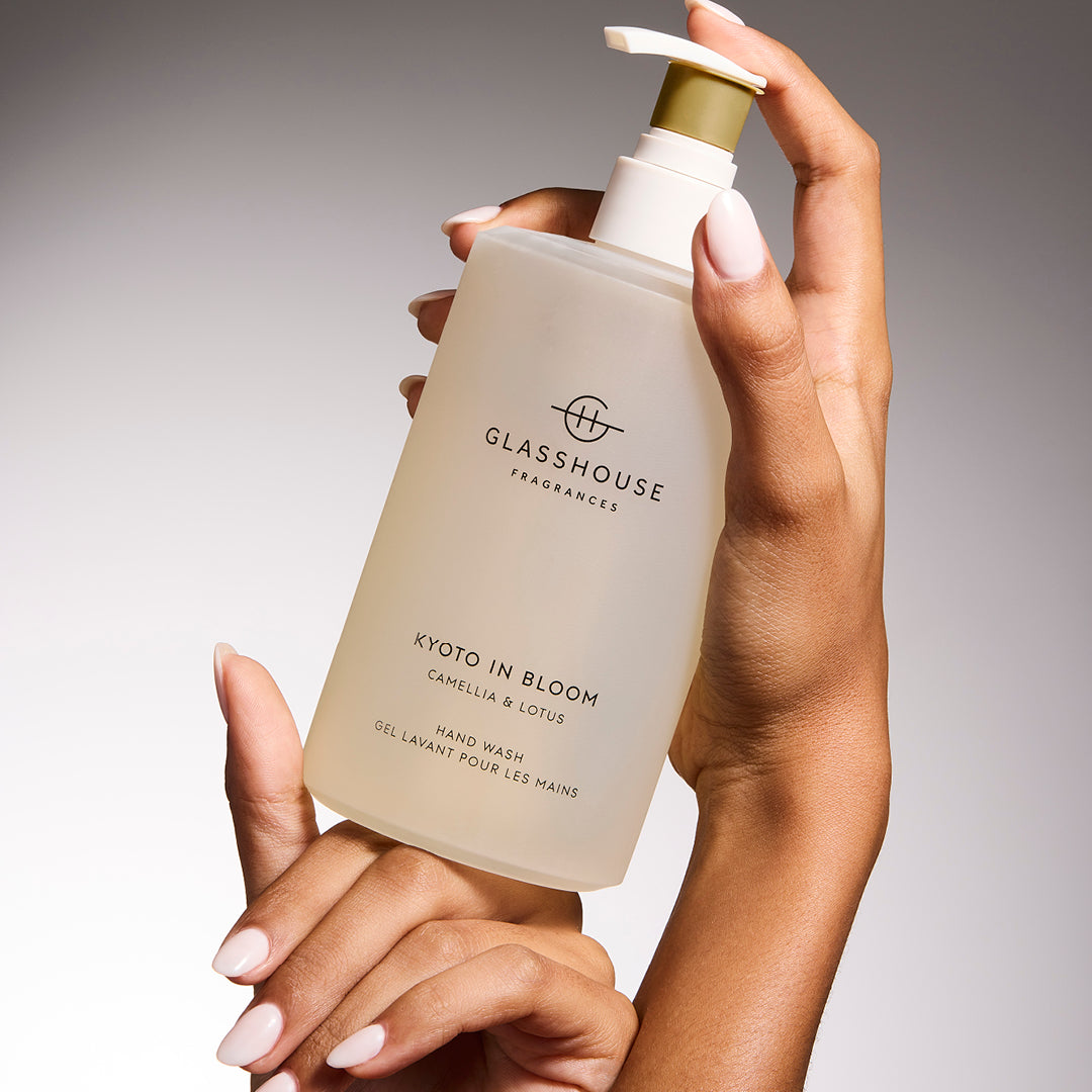 Glasshouse Fragrances Kyoto In Bloom Hand Lotion close up in hands.