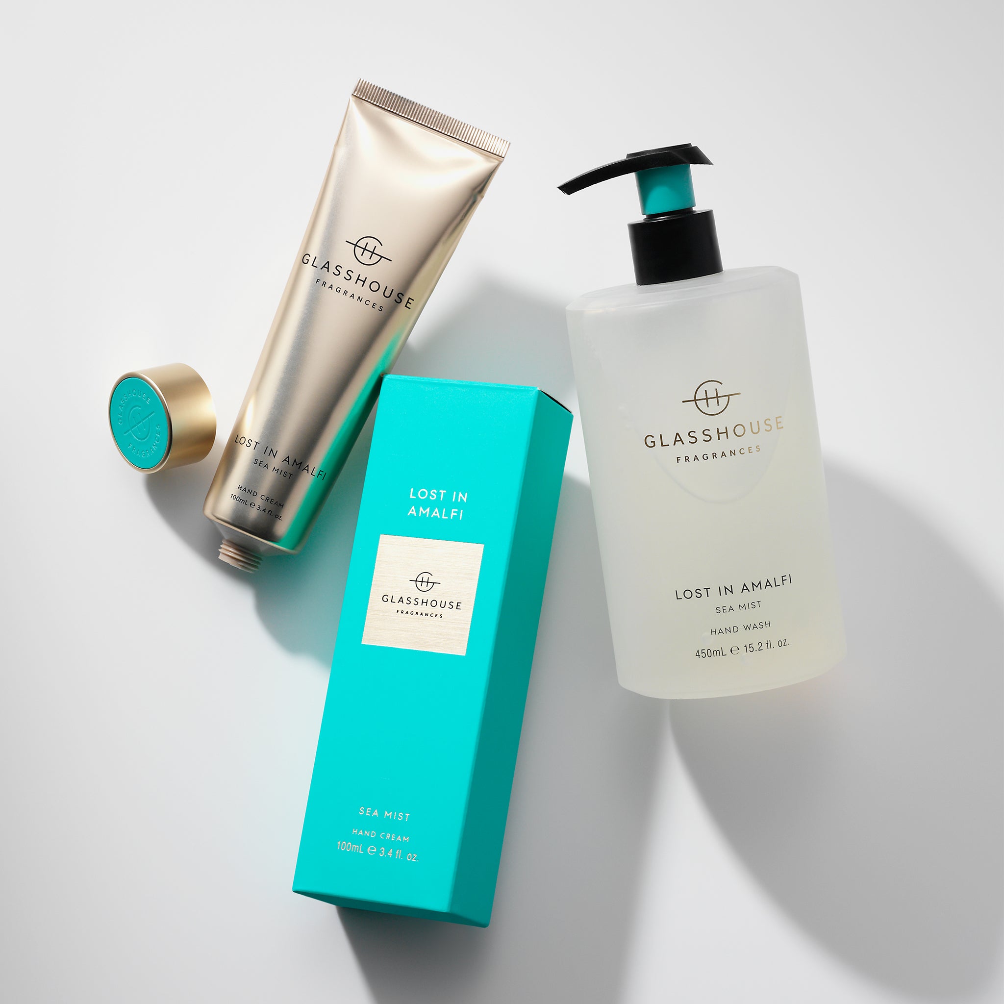 Glasshouse Fragrances Lost in Amalfi Sea Mist 100mL Hand Cream and 450mL Hand Wash flat-laid on tabletop