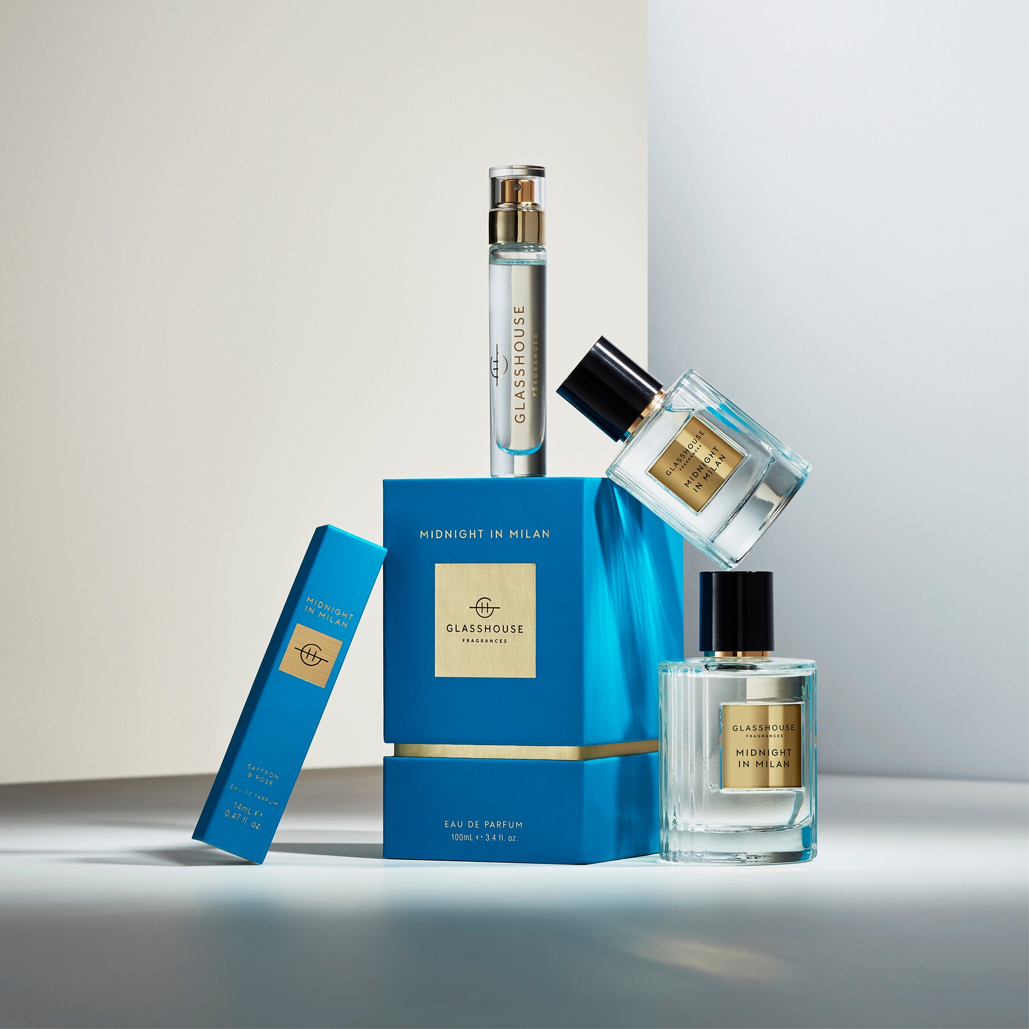 Glasshouse Fragrances Midnight in Milan Saffron and Rose - various sizes of Eau de Parfum and boxes arranged in a tower