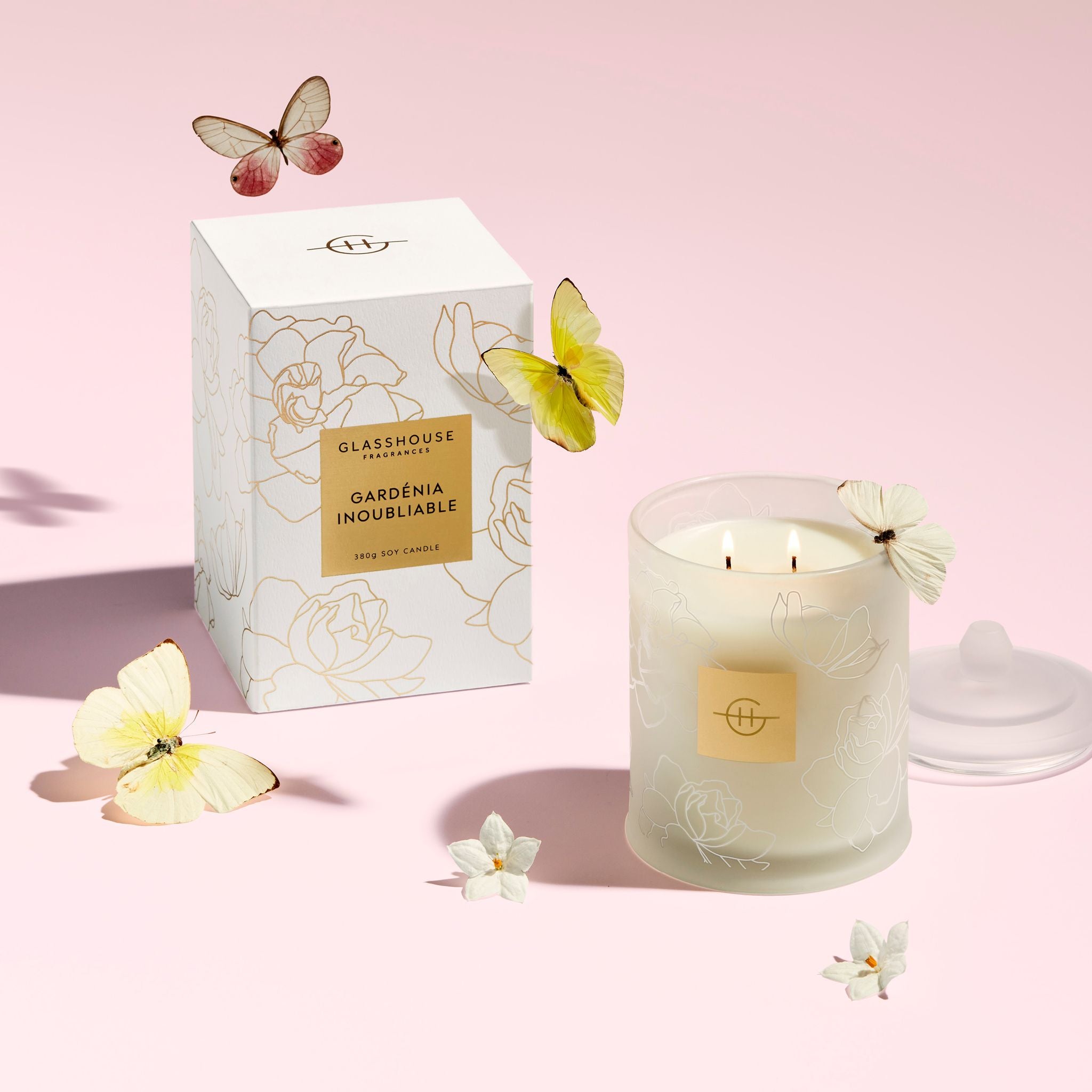 Burning Gardenia Inoubliable 380g Soy Candle next to product box with butterflies